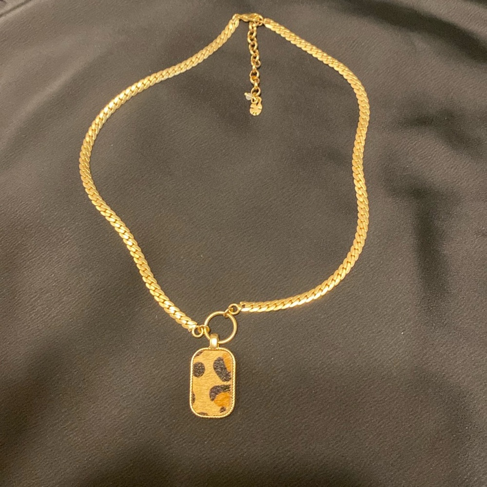 Lucky brand necklace with leopard charm.